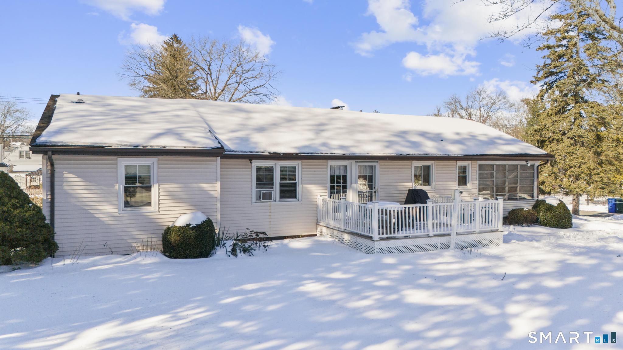 710 East Main Street Stratford, CT 06614 - Photo 24 of 34 a front view of a house with a garden and chairs