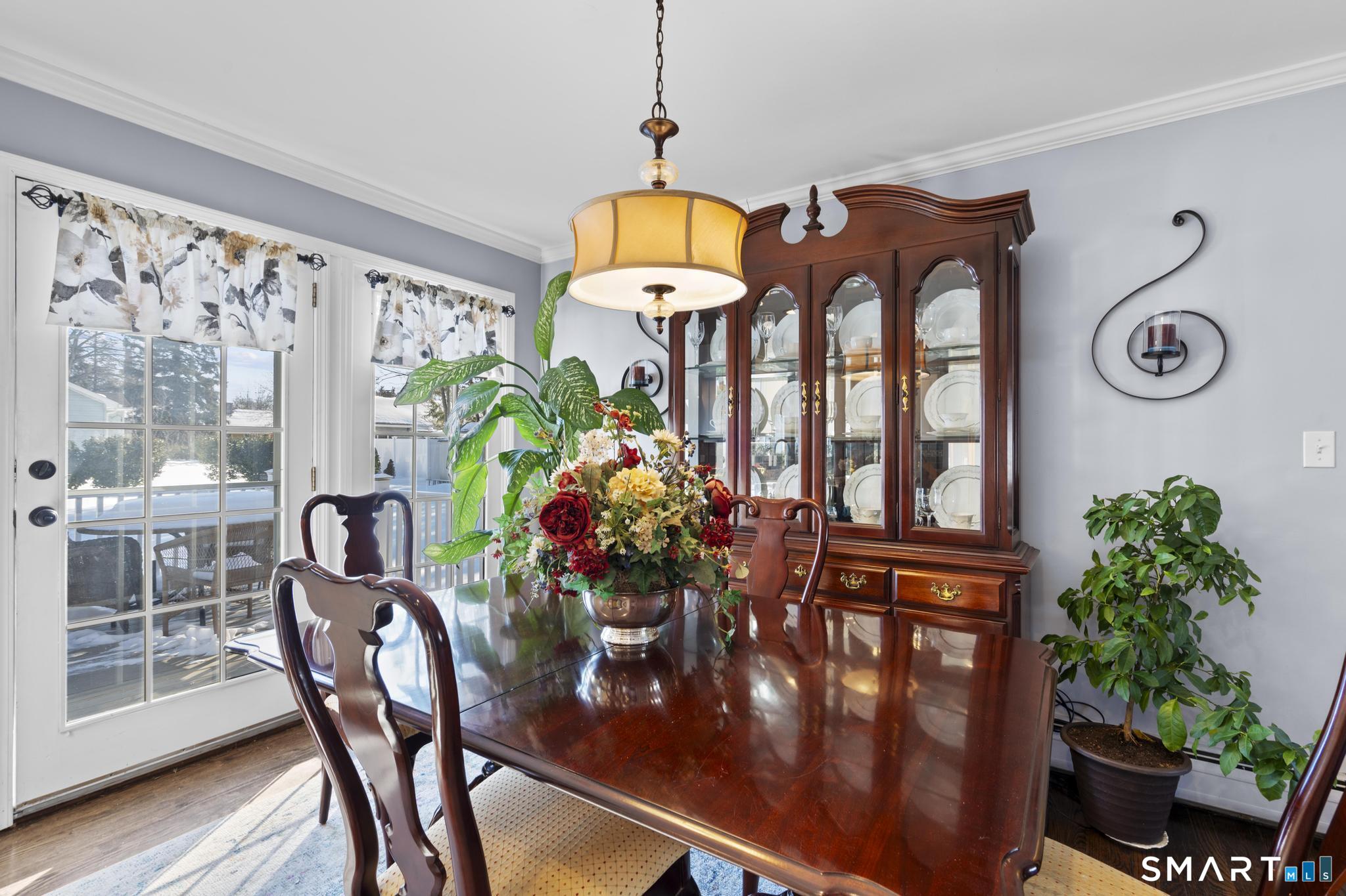 710 East Main Street Stratford, CT 06614 - Photo 10 of 34 a front view of a house with lots of furniture and wooden floor