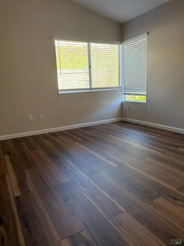 a room with window and a ceiling fan