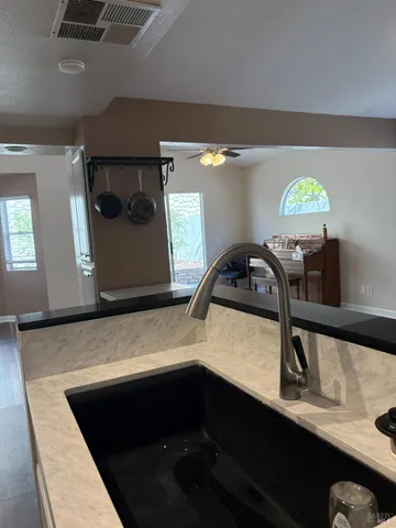 a view of living room with furniture and a window