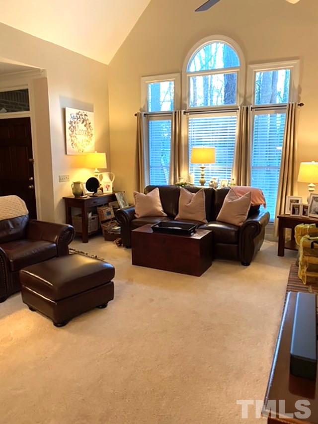 2017 Treverton Place Raleigh, NC 27609 - Photo 2 of 6 a living room with furniture and a large window