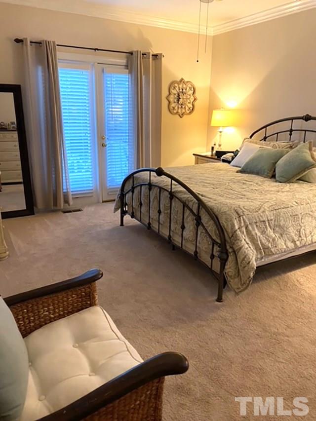 2017 Treverton Place Raleigh, NC 27609 - Photo 6 of 6 a bedroom with a bed and window