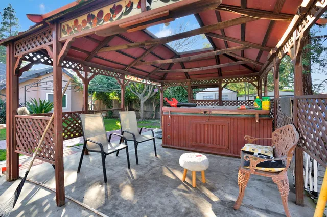 a view of a chairs and table in the patio