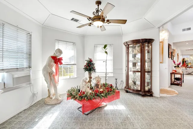 a view of a livingroom with furniture and entryway