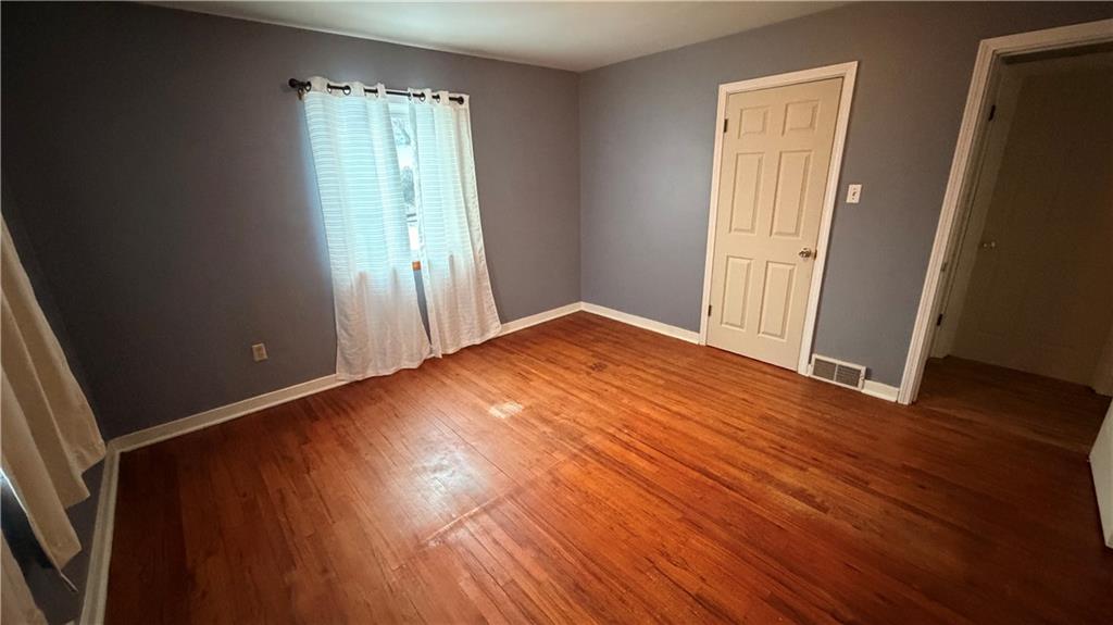 621 South Gosser Hill Road Leechburg, PA 15656 - Photo 11 of 15 an empty room with wooden floor and windows