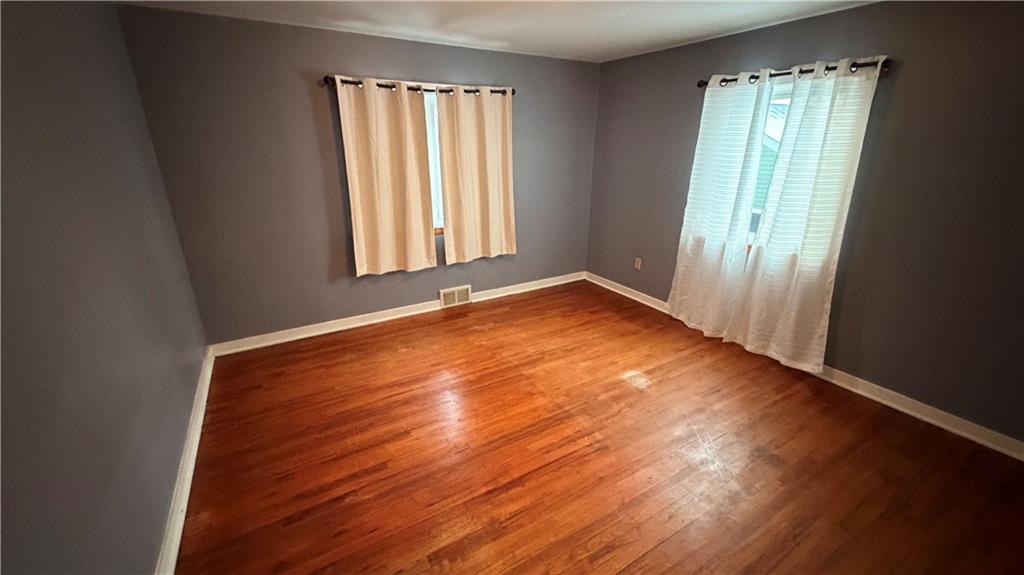 621 South Gosser Hill Road Leechburg, PA 15656 - Photo 12 of 15 an empty room with wooden floor and windows