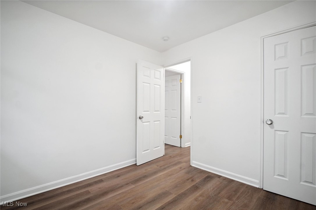 8796 West Ridgewood Drive Cleveland, OH 44130 - Photo 31 of 38 Unfurnished bedroom featuring dark wood-type flooring