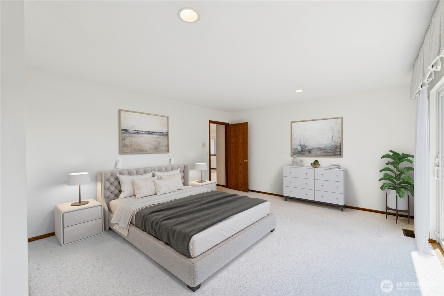 4158 Islander Way Anacortes, WA 98221 - Photo 18 of 40 a bedroom with a bed and a potted plant