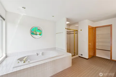 a bathroom with a tub and a sink