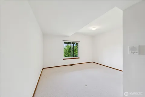 a bathroom with a granite countertop sink toilet a large mirror and shower
