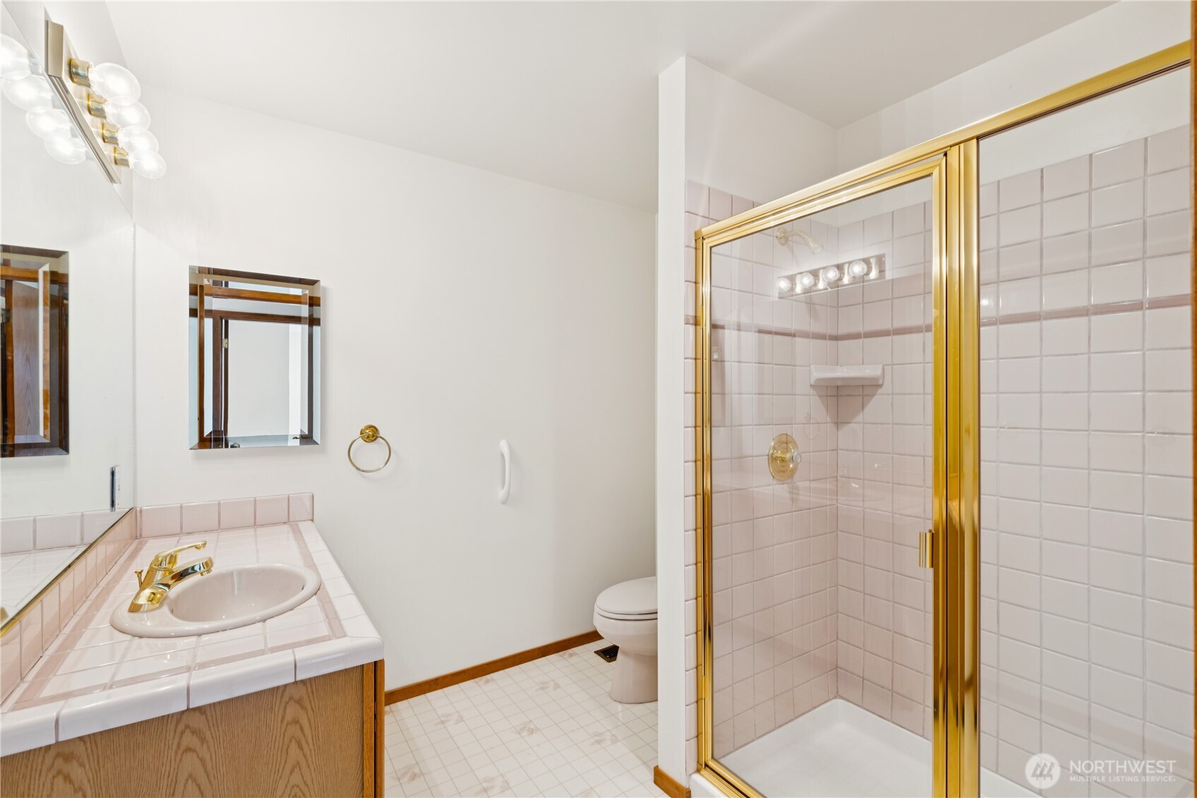 4158 Islander Way Anacortes, WA 98221 - Photo 34 of 40 a bathroom with a sink toilet and shower