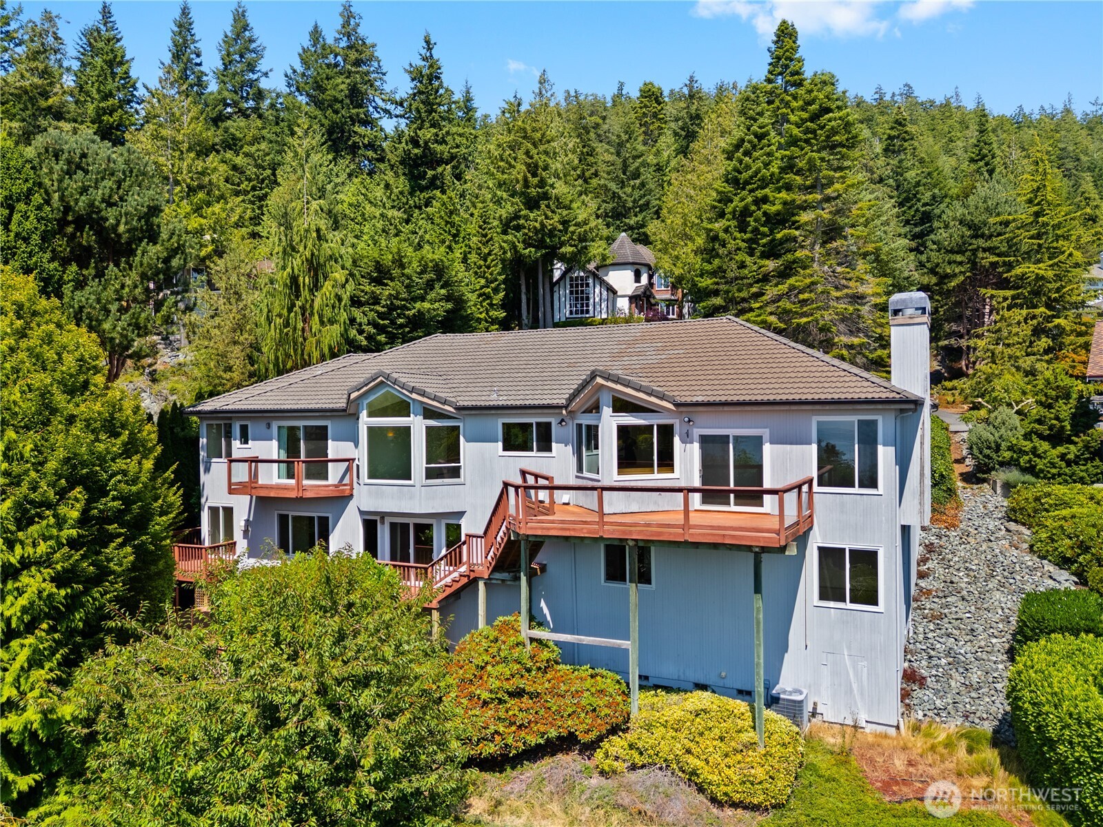 4158 Islander Way Anacortes, WA 98221 - Photo 36 of 40 a front view of a house with a garden