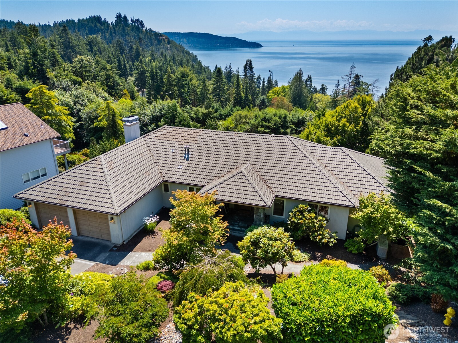 4158 Islander Way Anacortes, WA 98221 - Photo 39 of 40 a view of a house with a yard and potted plants