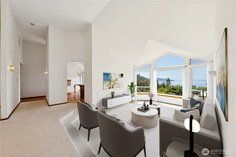 a view of a livingroom with furniture and window