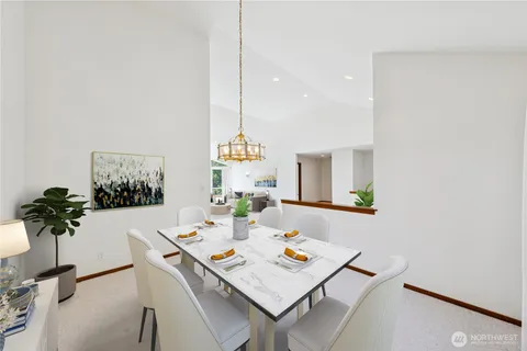 a view of a dining table and chairs in the room