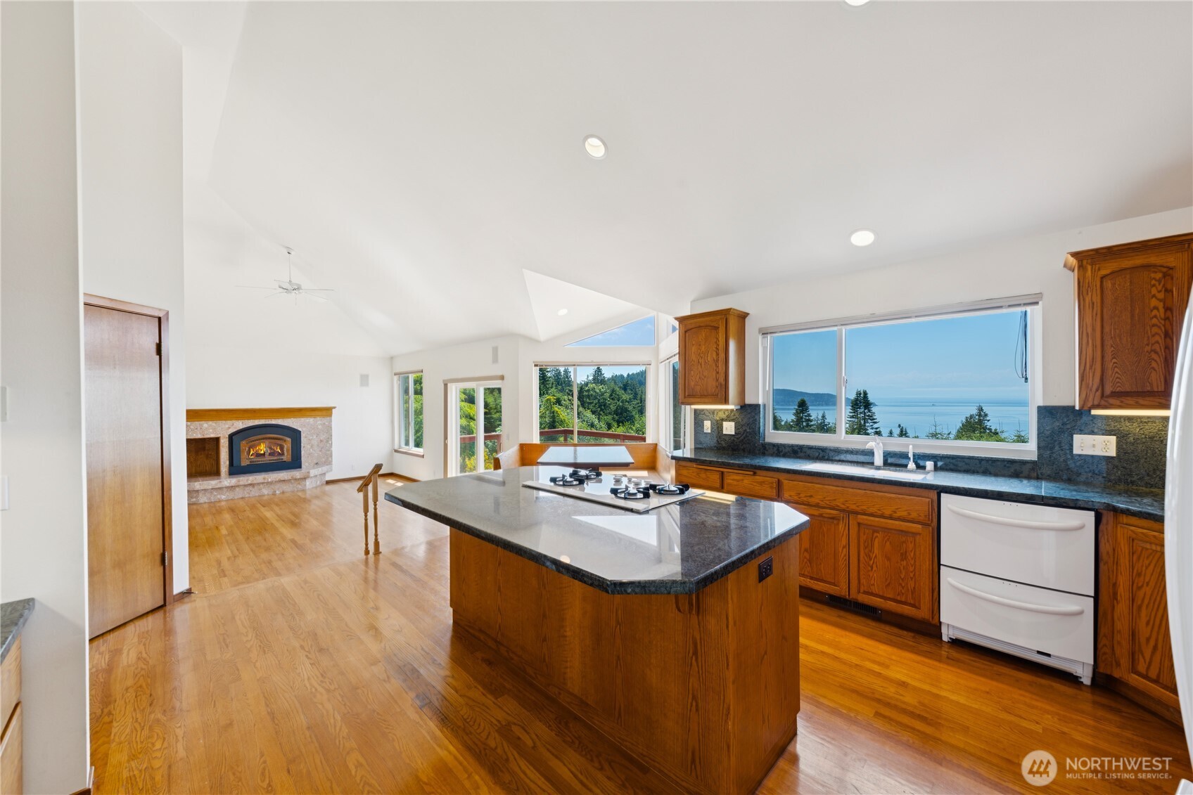 4158 Islander Way Anacortes, WA 98221 - Photo 9 of 40 a kitchen with stainless steel appliances granite countertop a sink stove and refrigerator