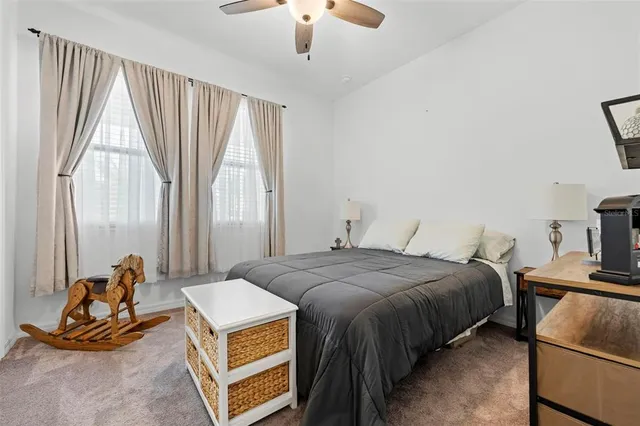 a bedroom with a bed and cabinets