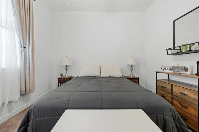 a room that has a bed and a chair in it