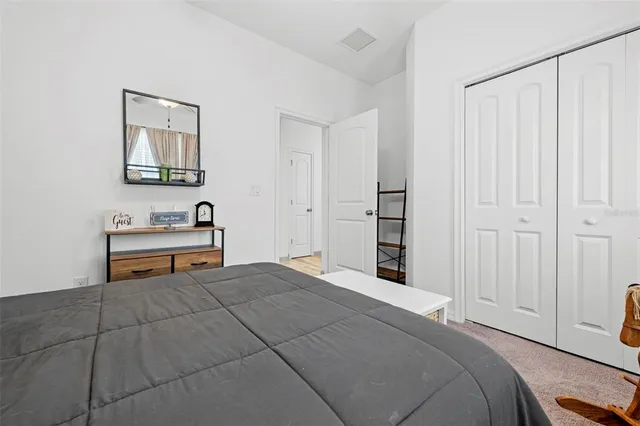 a bathroom with a granite countertop sink a toilet and bathtub