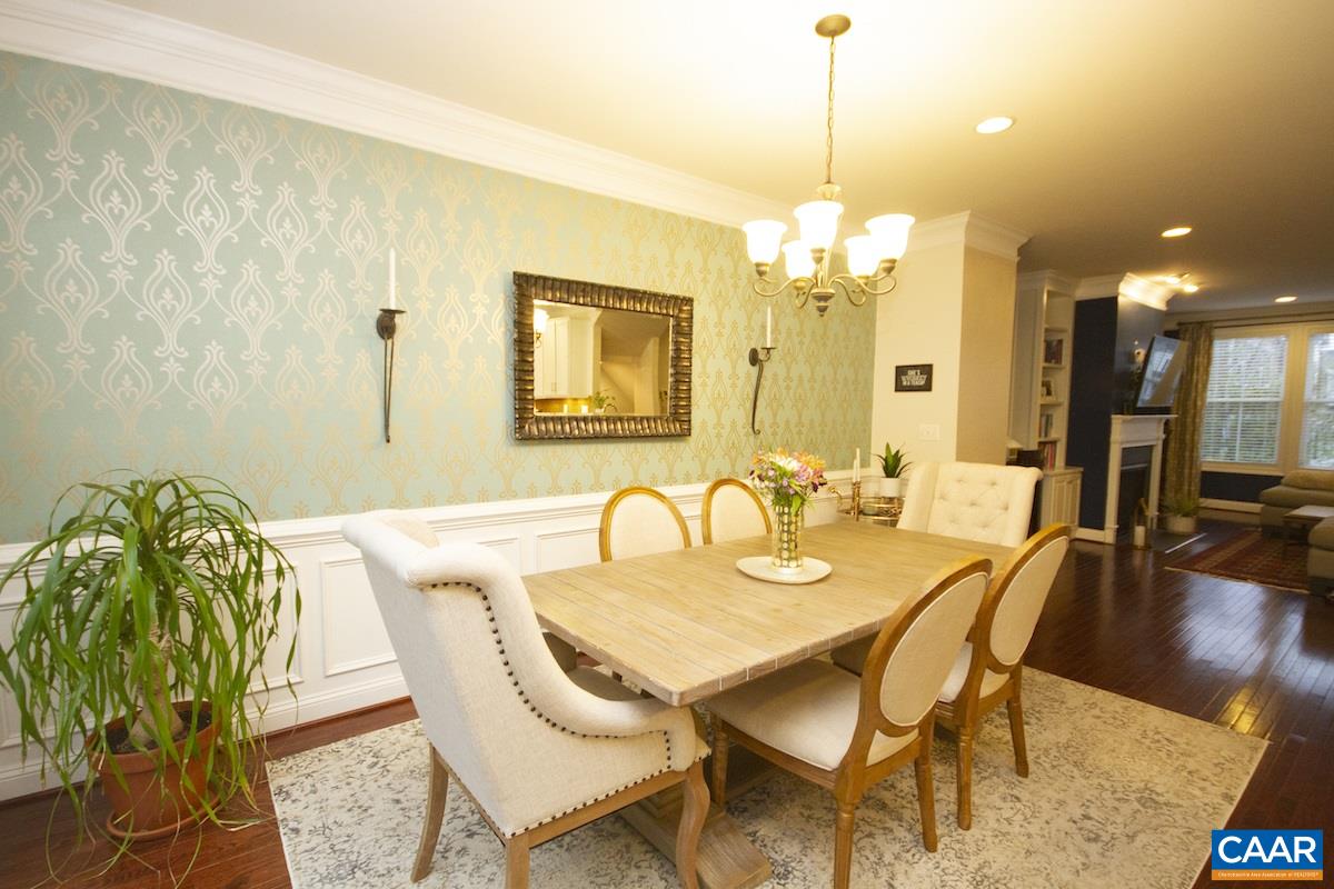 2122 Avinity Loop Charlottesville, VA 22902 - Photo 11 of 27 a dining room with furniture and wooden floor