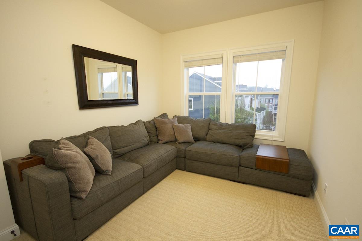 2122 Avinity Loop Charlottesville, VA 22902 - Photo 16 of 27 a living room with furniture and a window