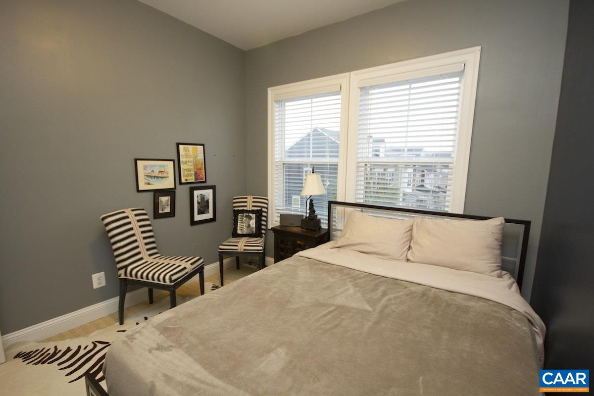 2122 Avinity Loop Charlottesville, VA 22902 - Photo 17 of 27 a bedroom with a bed and a large window