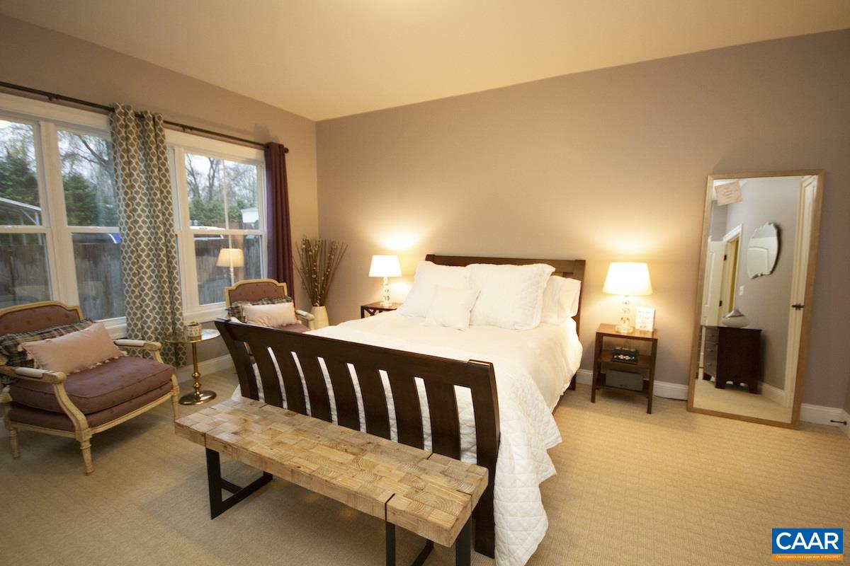 2122 Avinity Loop Charlottesville, VA 22902 - Photo 18 of 27 a bedroom with furniture and a fireplace