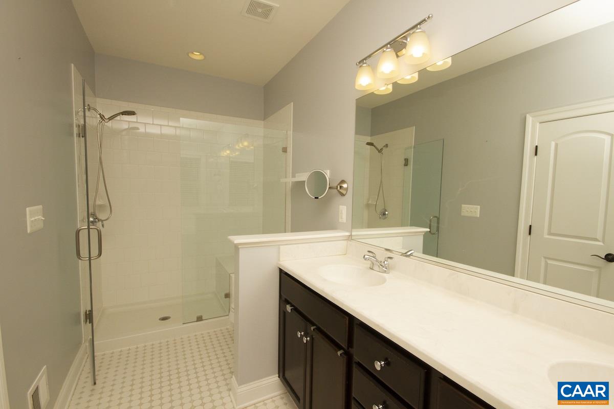 2122 Avinity Loop Charlottesville, VA 22902 - Photo 20 of 27 a bathroom with a sink double vanity and a mirror