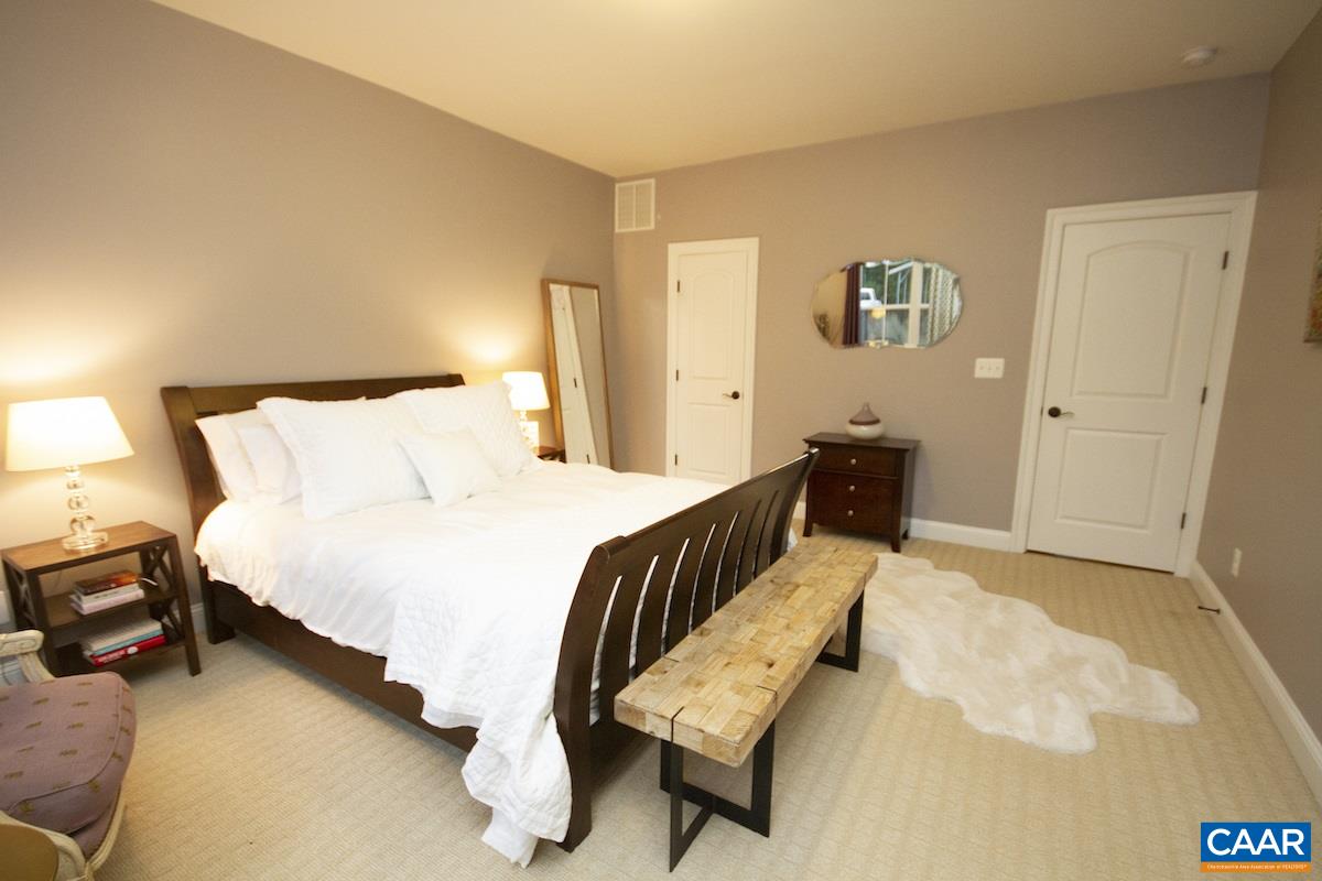 2122 Avinity Loop Charlottesville, VA 22902 - Photo 3 of 27 a bed room with a bed and a chair