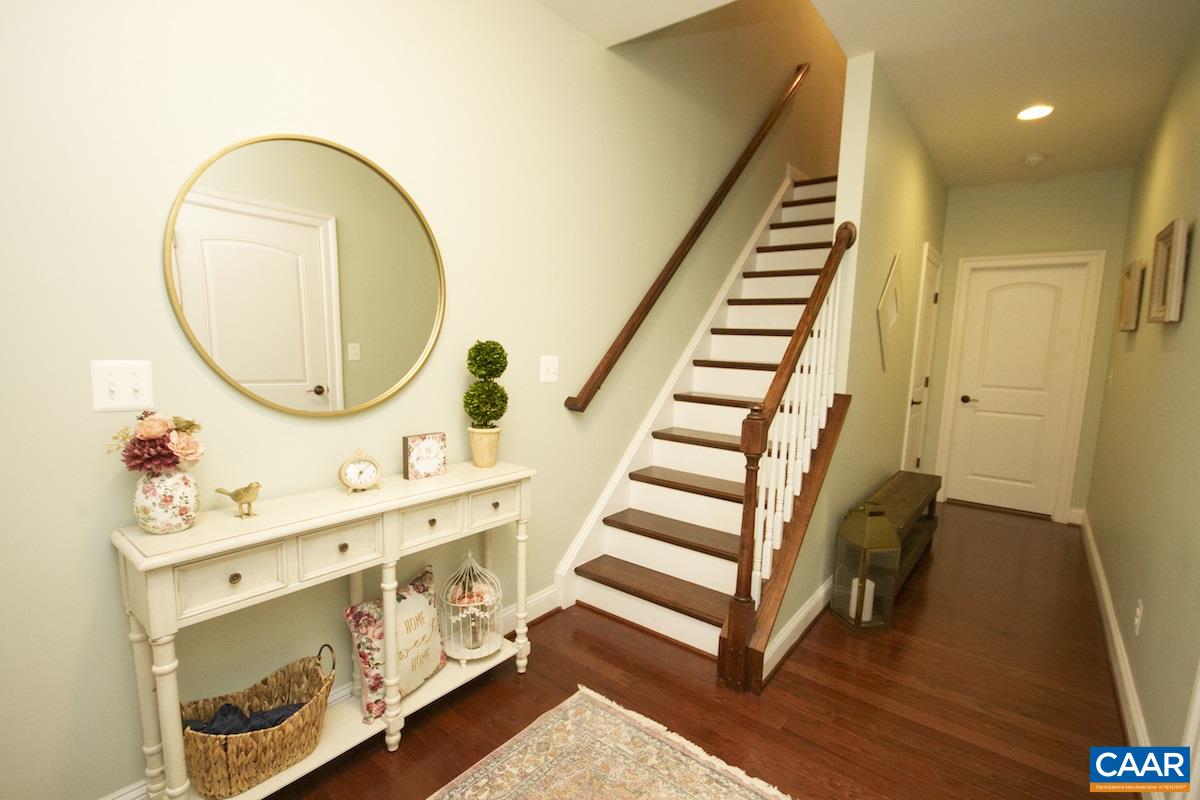 2122 Avinity Loop Charlottesville, VA 22902 - Photo 6 of 27 a view of a hallway with entryway wooden floor and front door