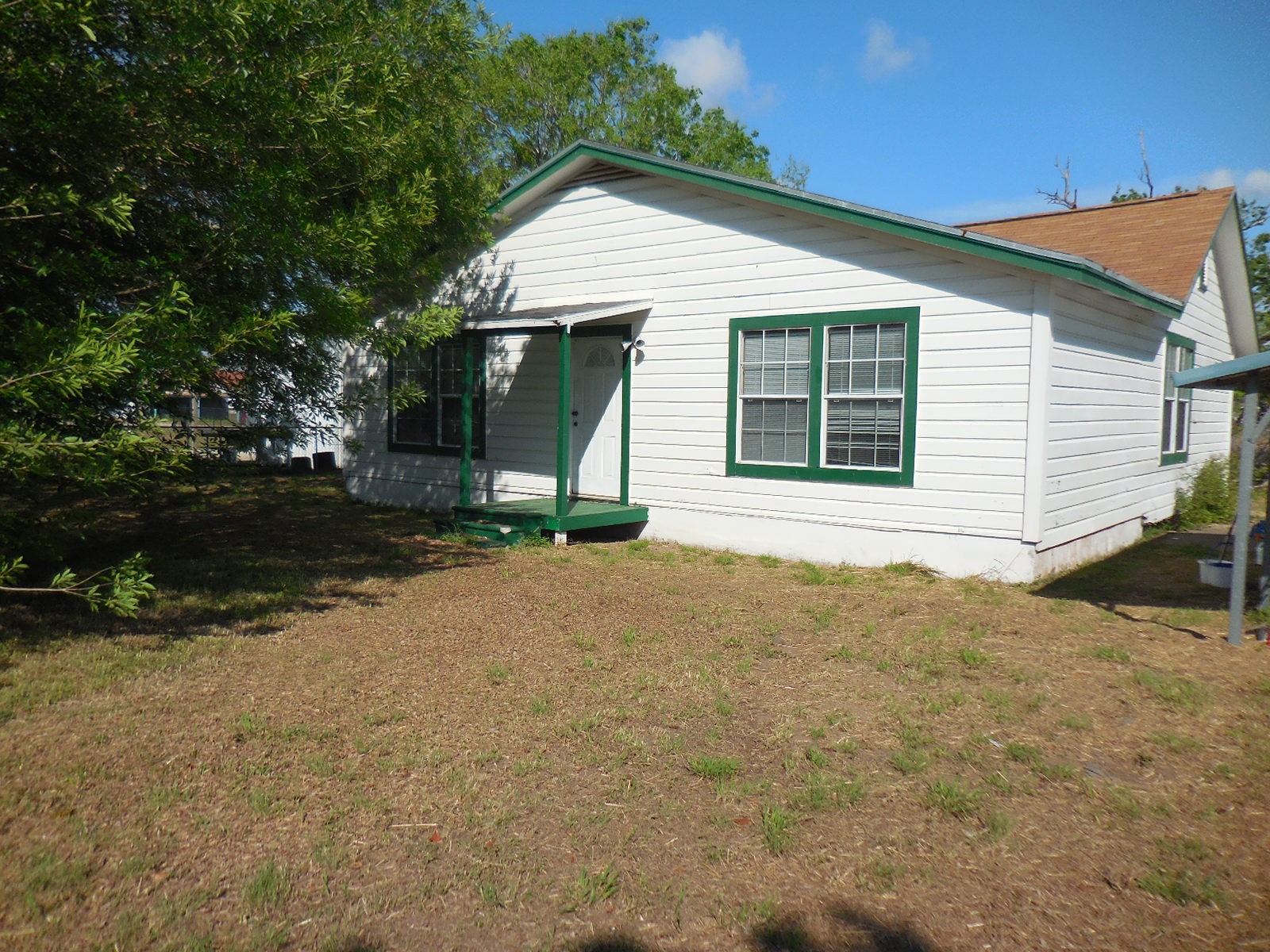 628 Austin Street West Matagorda, TX 77457 - Photo 1 of 19 a view of a house with backyard and garden
