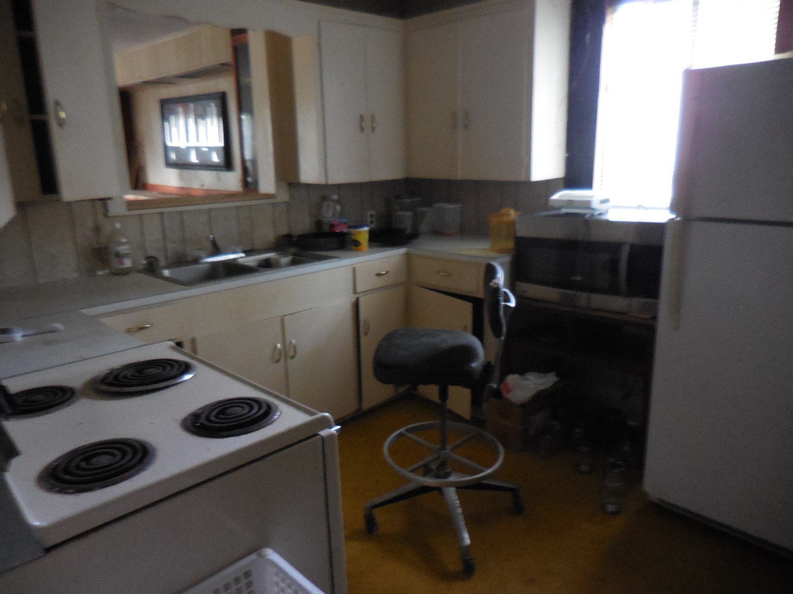 628 Austin Street West Matagorda, TX 77457 - Photo 14 of 19 a kitchen with a sink a stove and a refrigerator