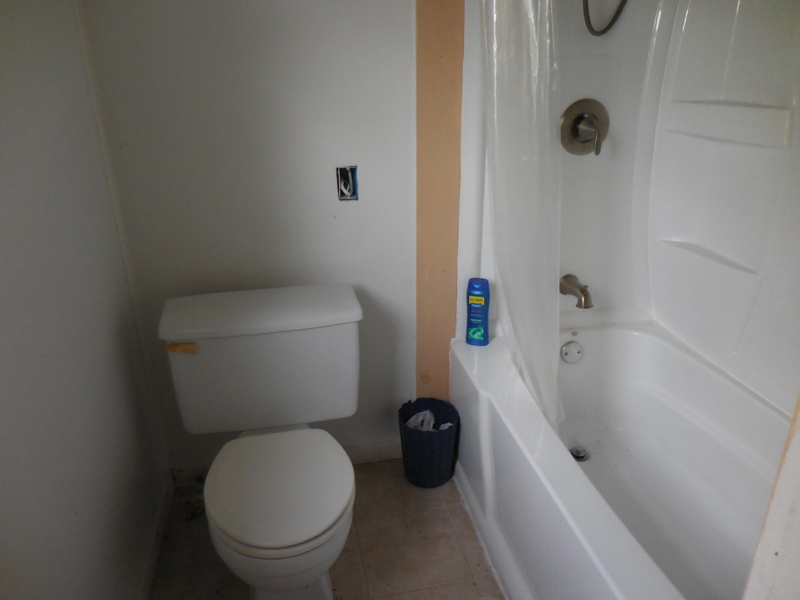 628 Austin Street West Matagorda, TX 77457 - Photo 18 of 19 a white toilet sitting next to a bath tub