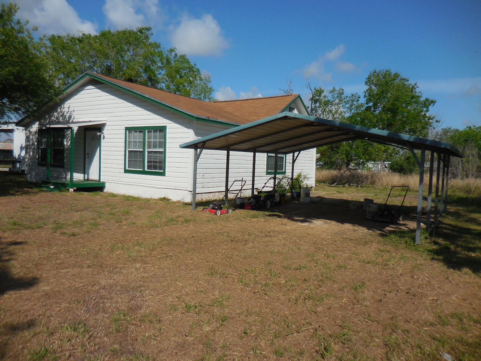 628 Austin Street West Matagorda, TX 77457 - Photo 8 of 19 a view of a house with backyard and sitting area