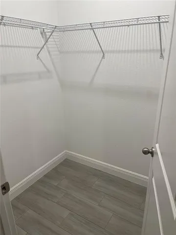 a view of a room with racks on the wall