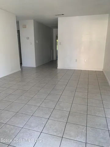 an empty room with a bench