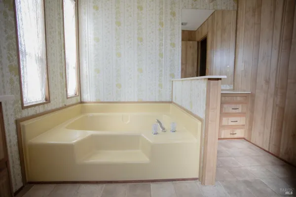 a view of a bathtub in a bathroom