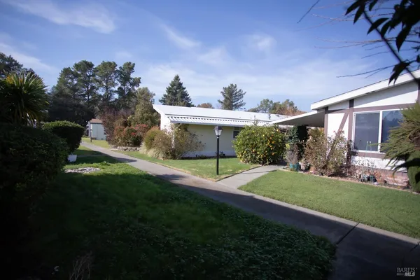 a view of a house with a back yard