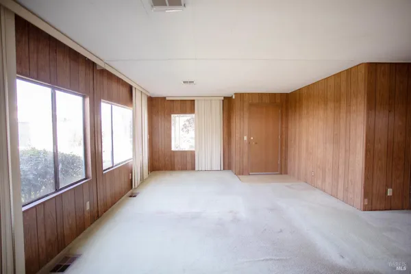 a view of a room with large windows