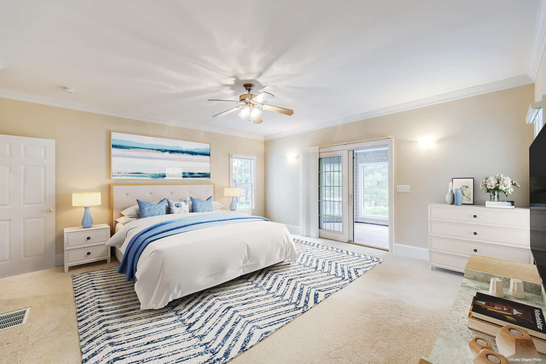 29 Reflection Drive Sandwich, MA 02563 - Photo 19 of 51 a spacious bedroom with a large bed and a chandelier
