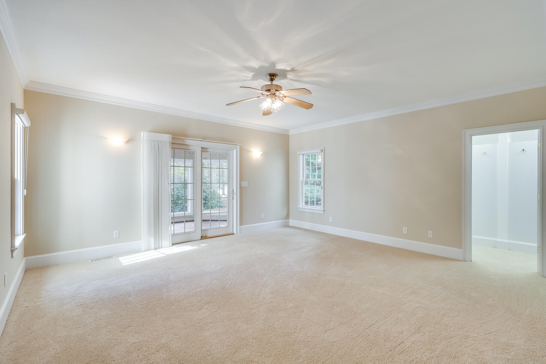 29 Reflection Drive Sandwich, MA 02563 - Photo 20 of 51 a view of a livingroom with a window and a ceiling fan