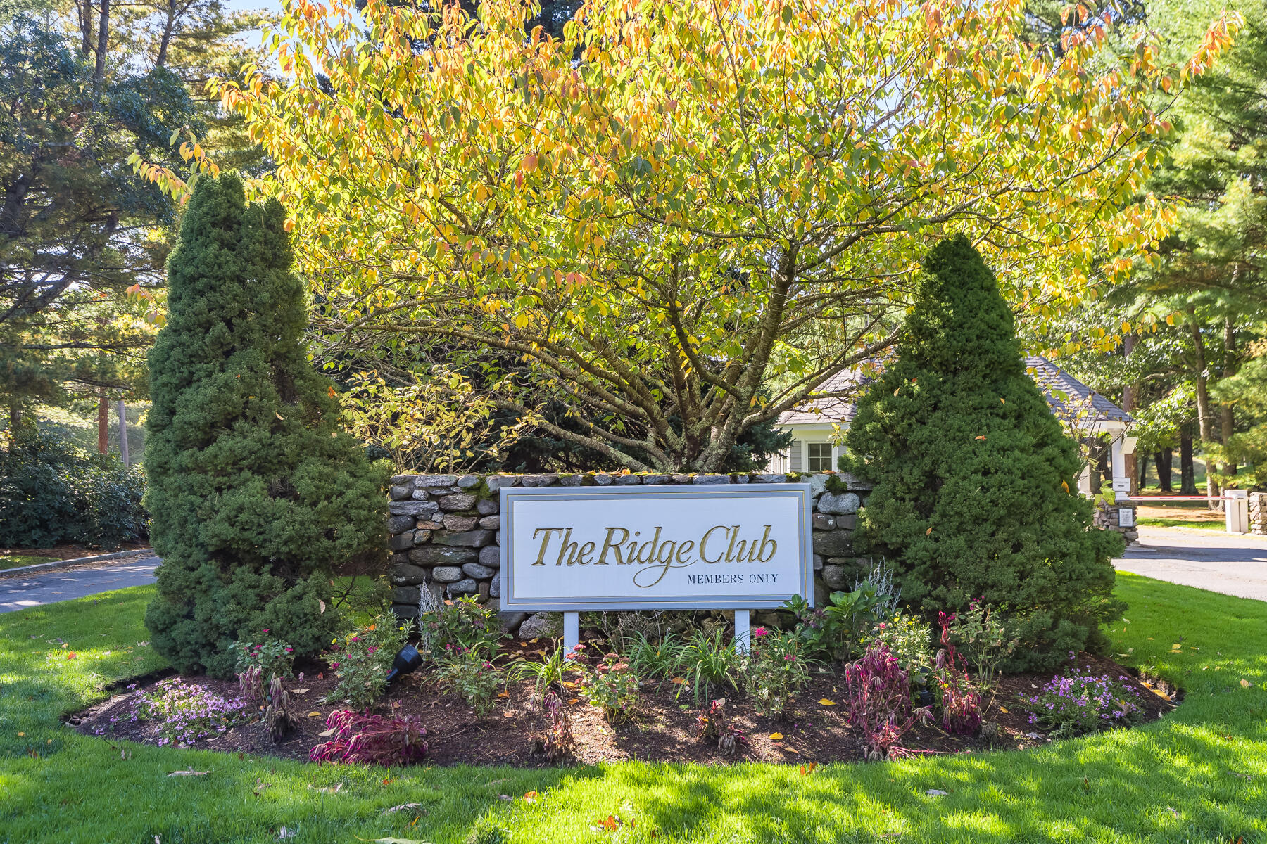 29 Reflection Drive Sandwich, MA 02563 - Photo 2 of 51 a sign that is sitting in front of flowers