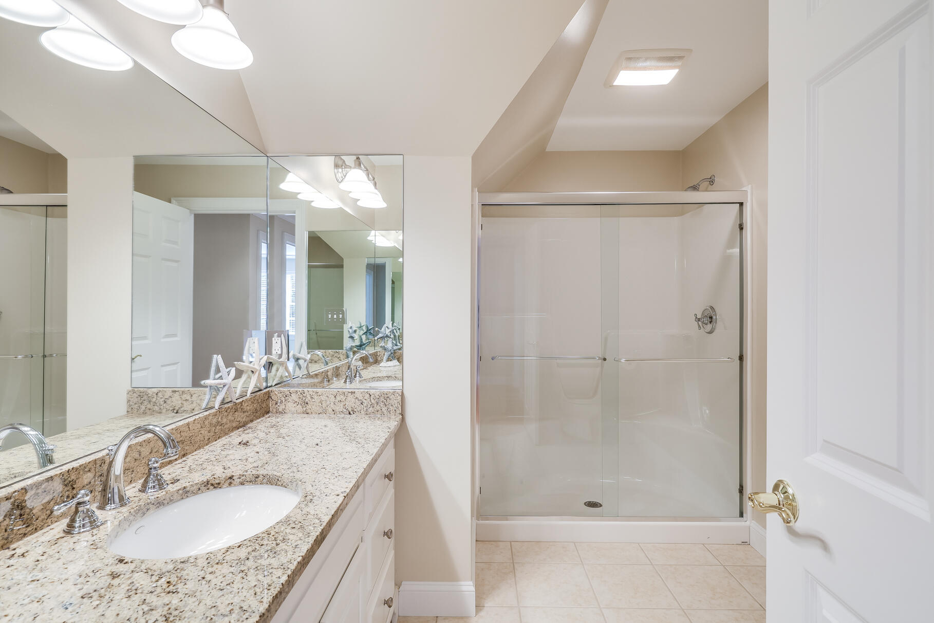 29 Reflection Drive Sandwich, MA 02563 - Photo 39 of 51 a bathroom with a granite countertop sink a mirror and shower