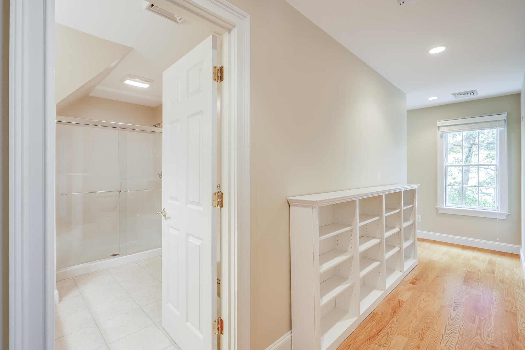 29 Reflection Drive Sandwich, MA 02563 - Photo 40 of 51 a view of an empty room with wooden floor and a window