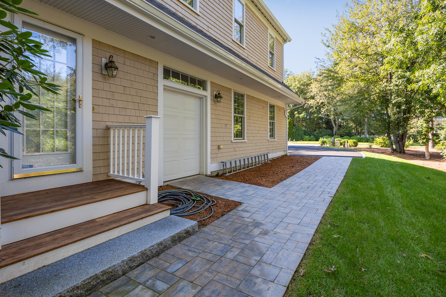 29 Reflection Drive Sandwich, MA 02563 - Photo 46 of 51 a backyard of a house with table and chairs