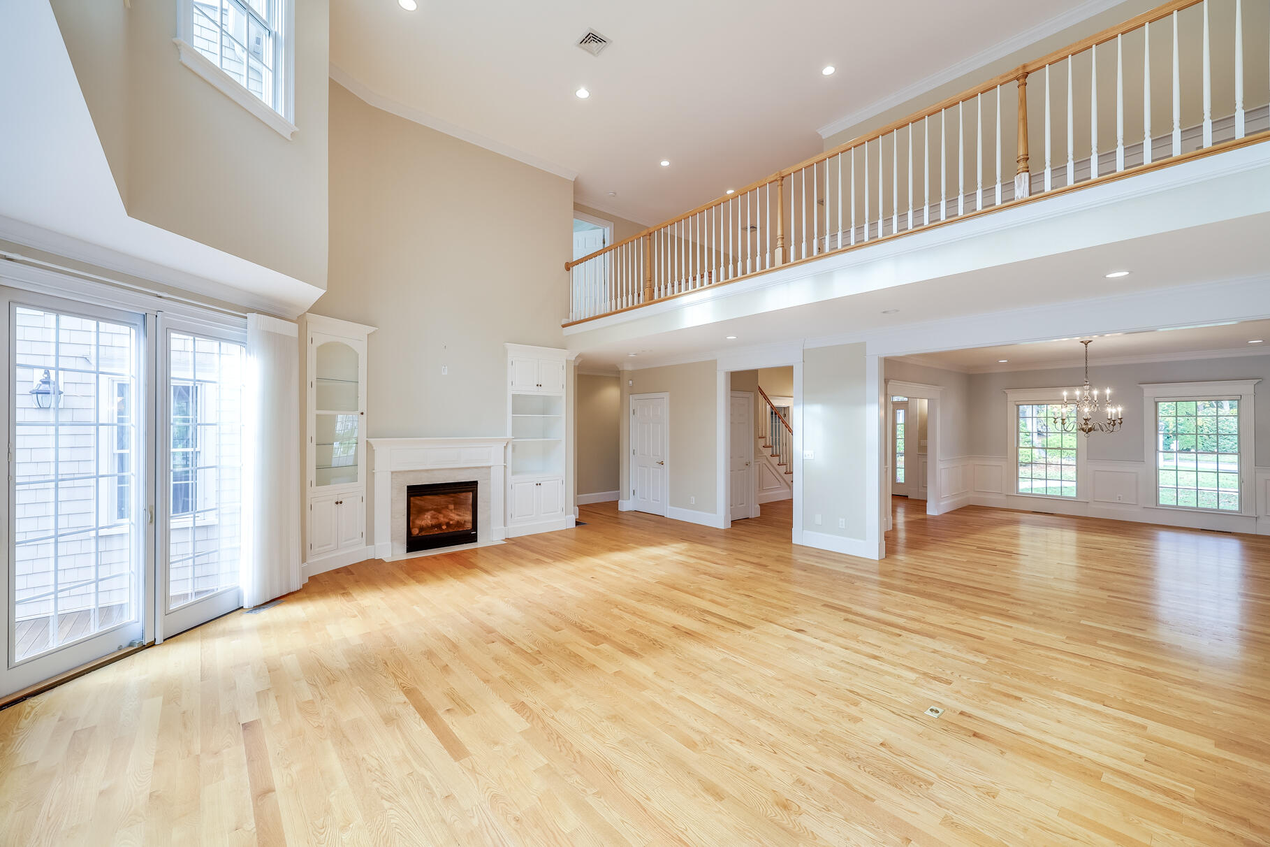 29 Reflection Drive Sandwich, MA 02563 - Photo 5 of 51 a view of an empty room with wooden floor and a window