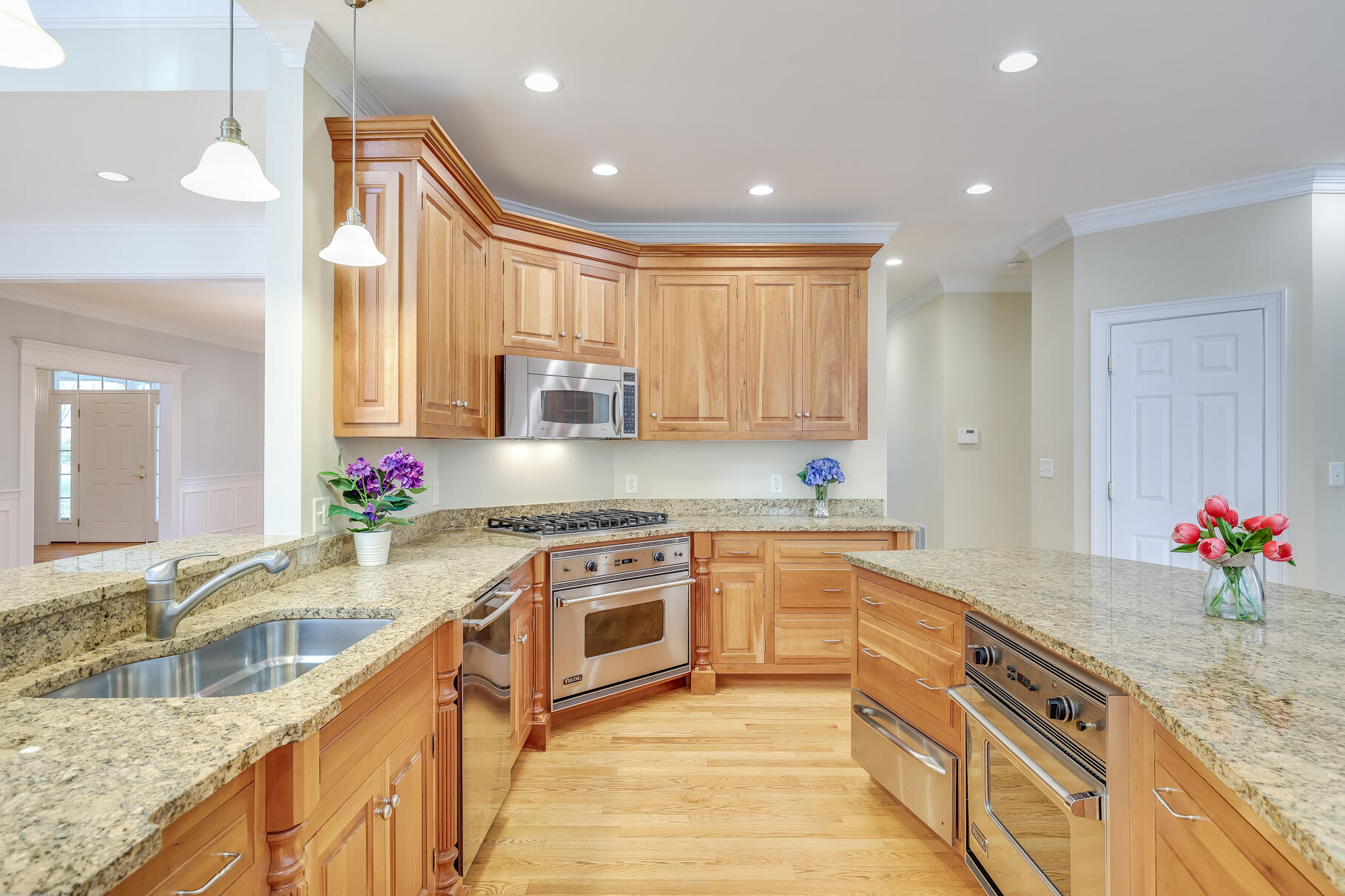 29 Reflection Drive Sandwich, MA 02563 - Photo 10 of 51 a large kitchen with granite countertop a sink and white cabinets