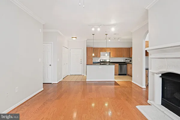 a large kitchen with cabinets and stainless steel appliances
