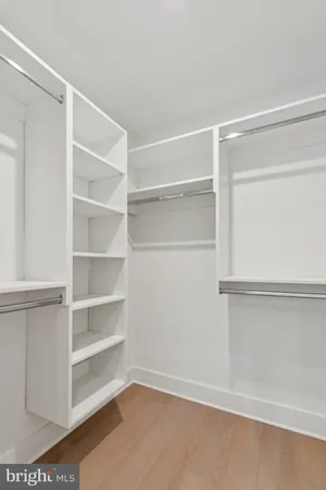 a view of an empty walk in closet