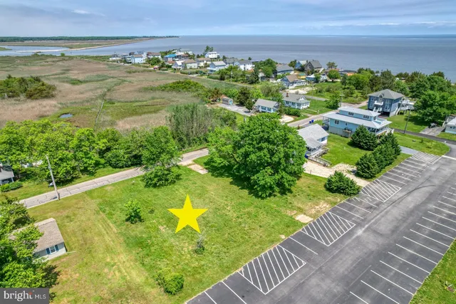 a view of a lake with a yard